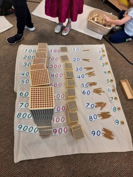 Various 3D displays showing the magnitude of certain numbers.